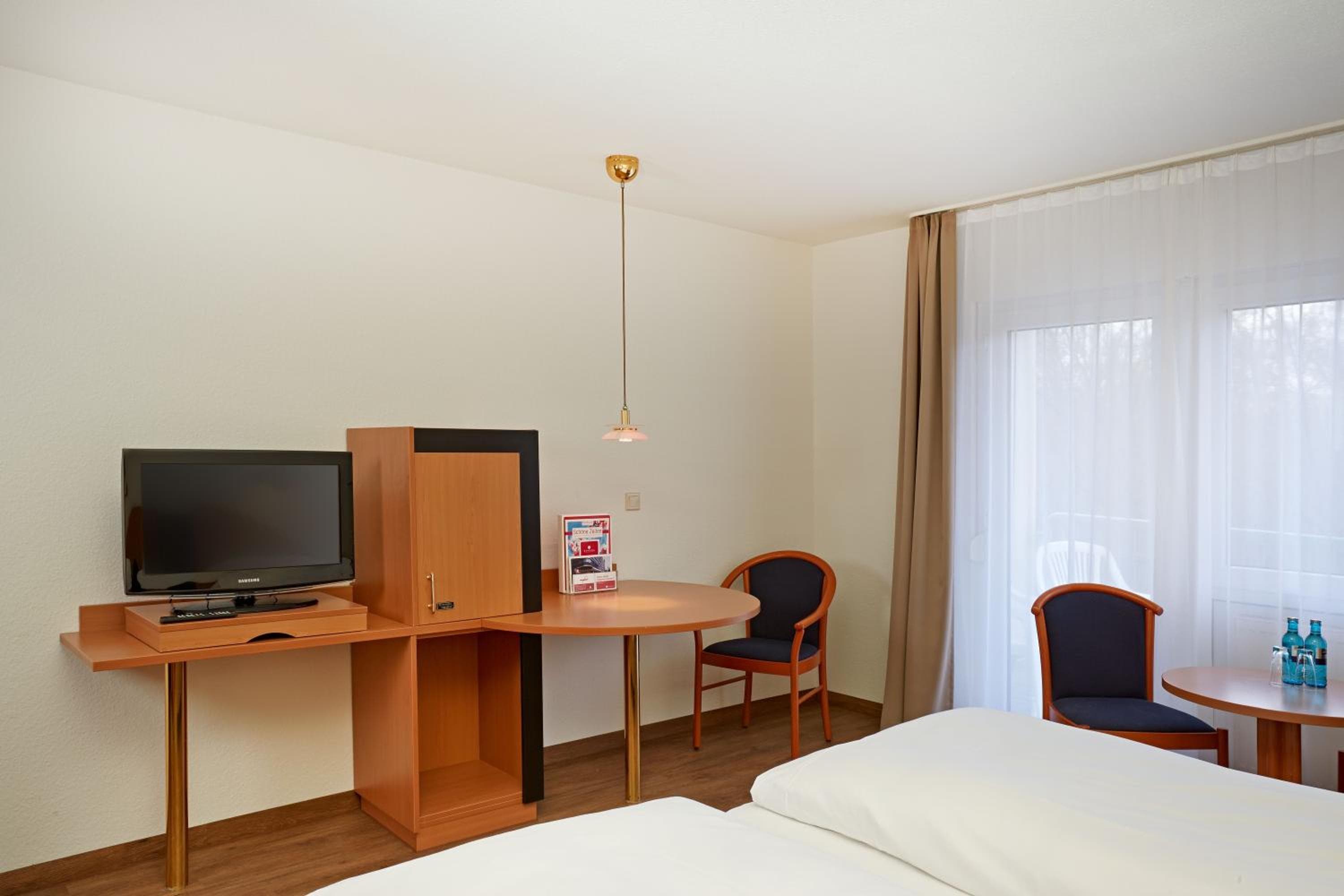 Hotel room at Sunday Hotel Wiesbaden Niedernhausen Apartments