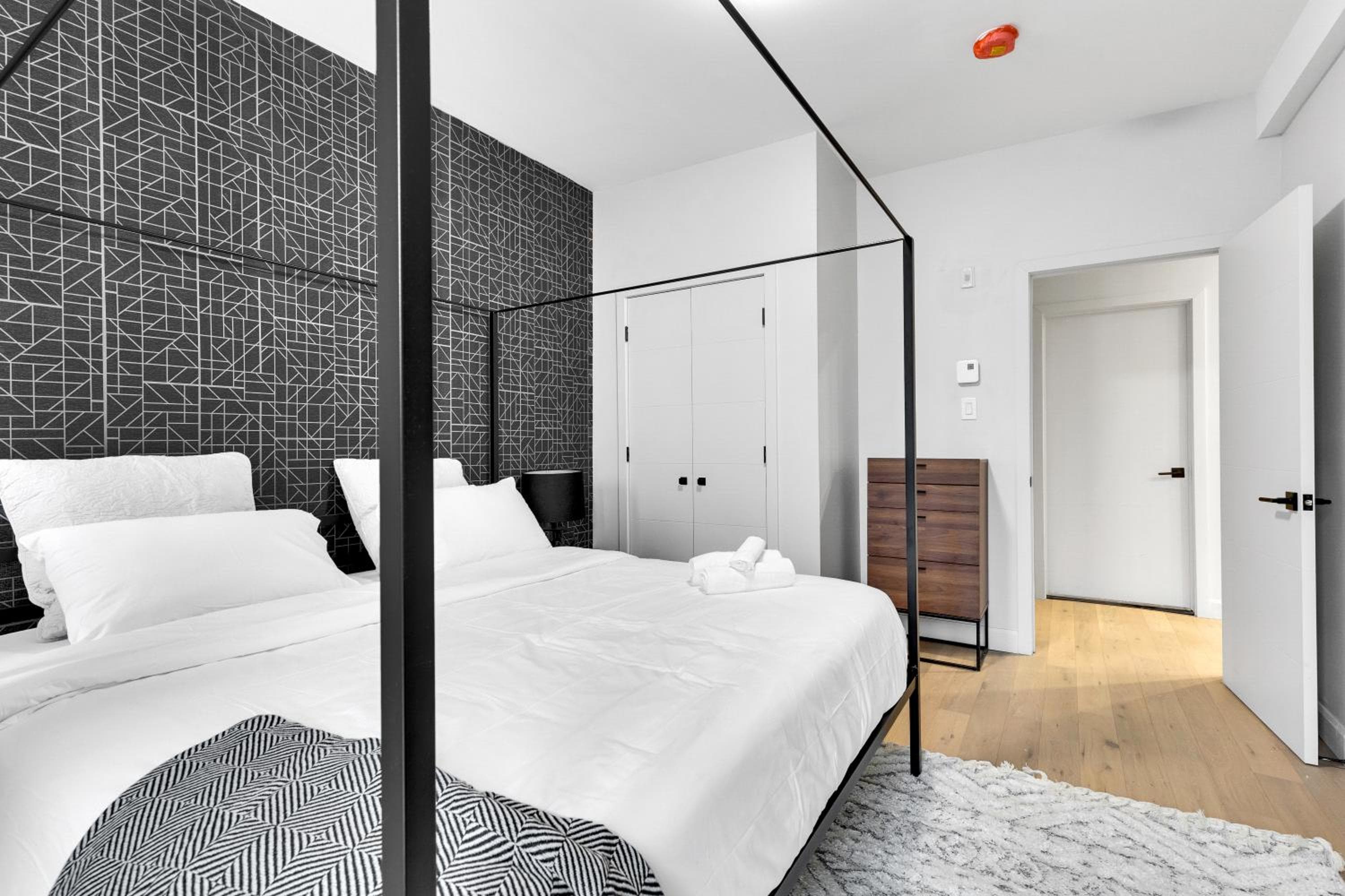 Bedroom at Deluxe Suites Downtown Montreal