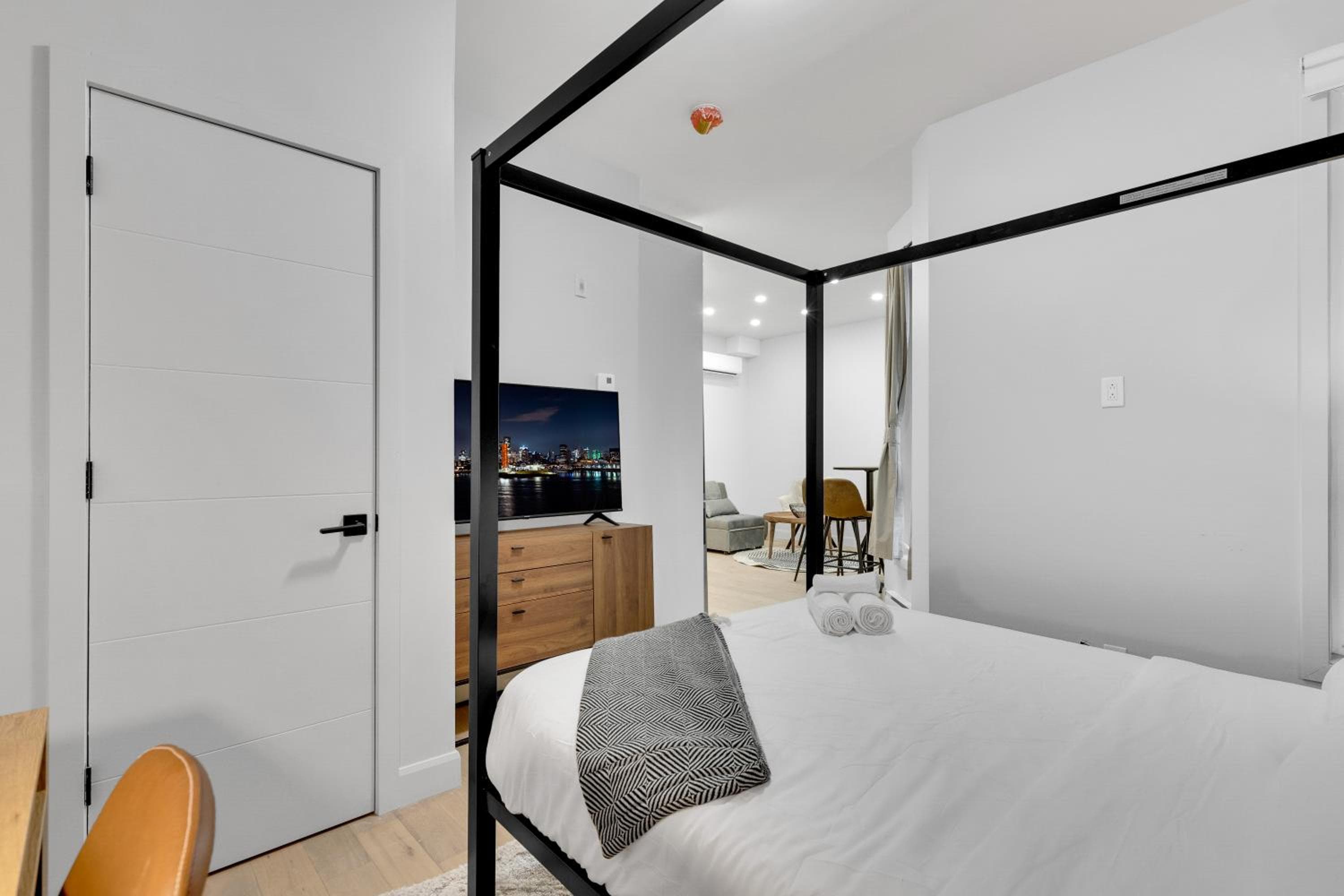 Bedroom at Deluxe Suites Downtown Montreal