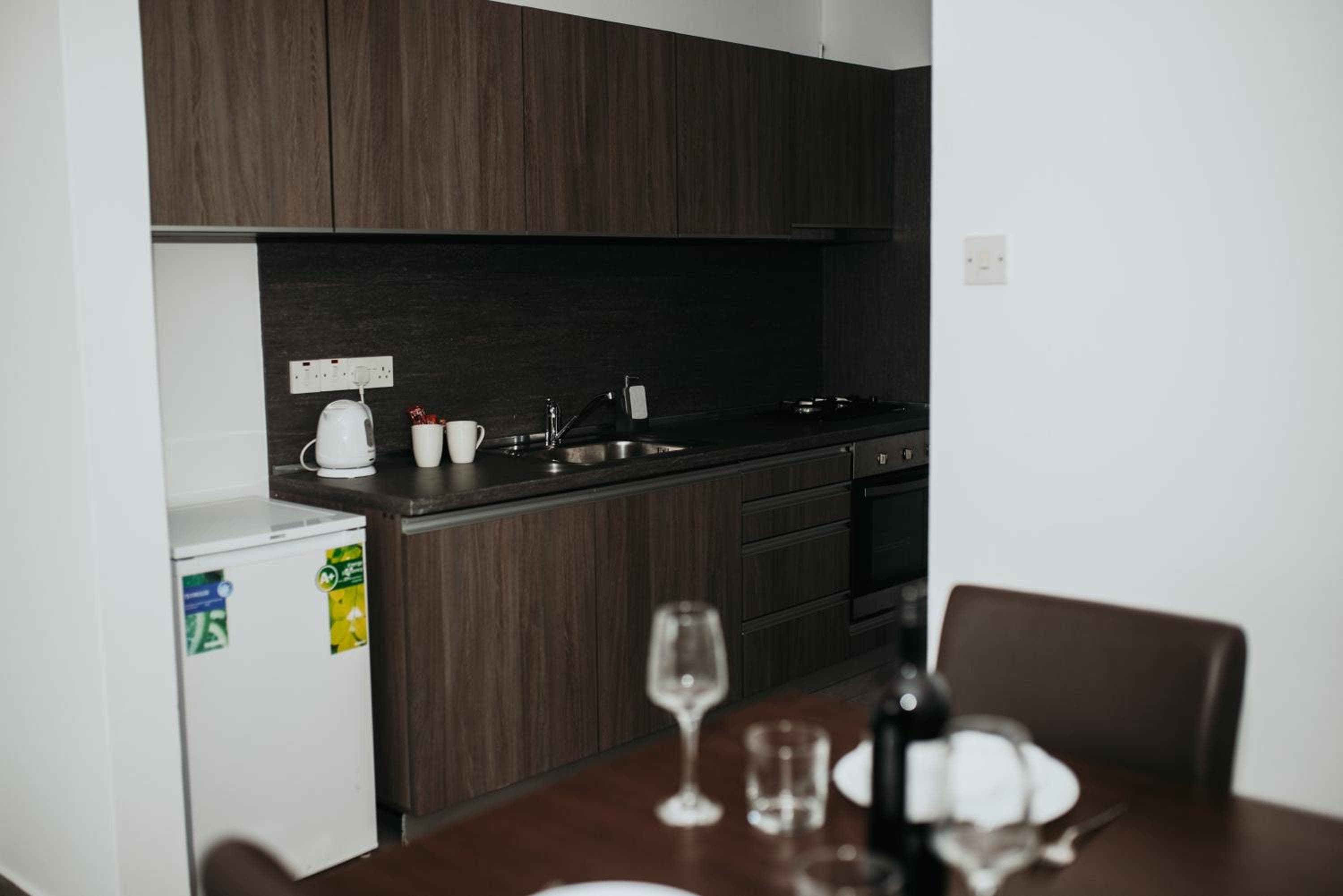 Kitchen at Ovis Hotel Apartments