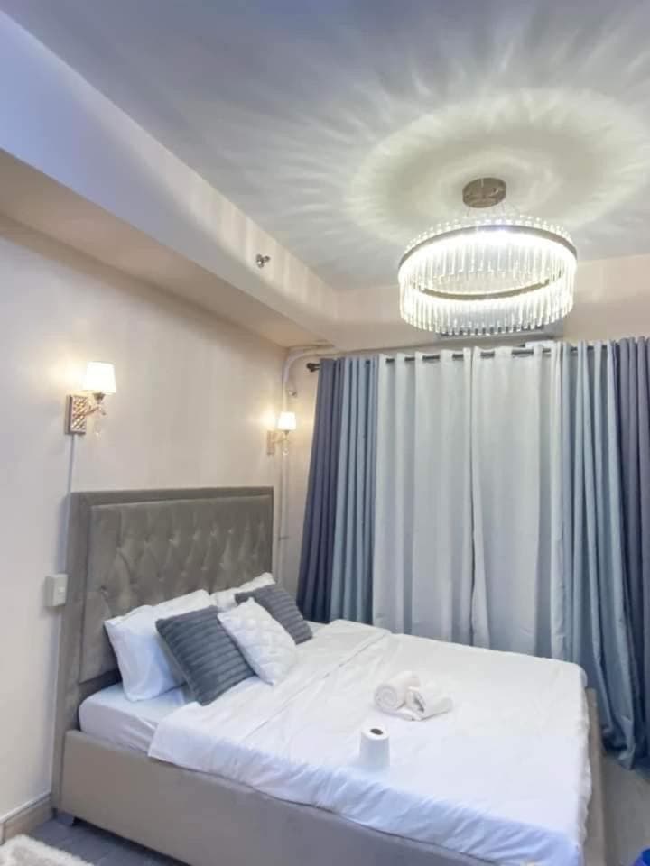 Hotel room at Grace Residences Elevate Escapes - near BGC airport