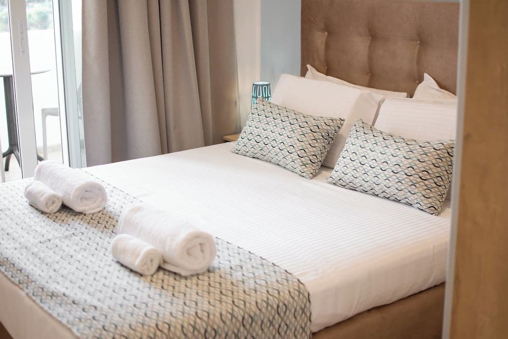 Bedroom at Infinity Wellness Apartment Hotel