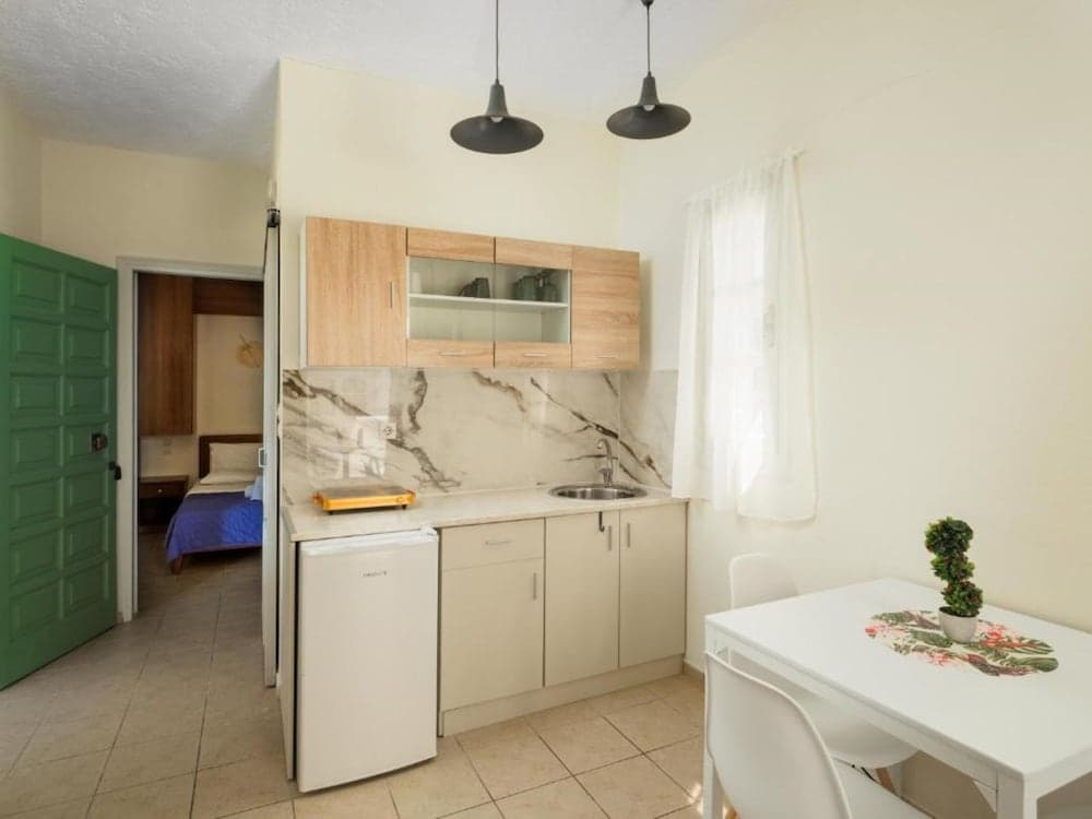 Kitchen at Divina Apartments  by Estia