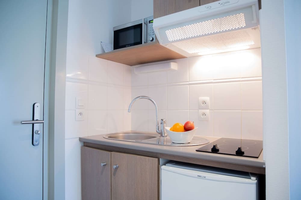 Kitchen at Comfort Aparthotel Cannes Mandelieu