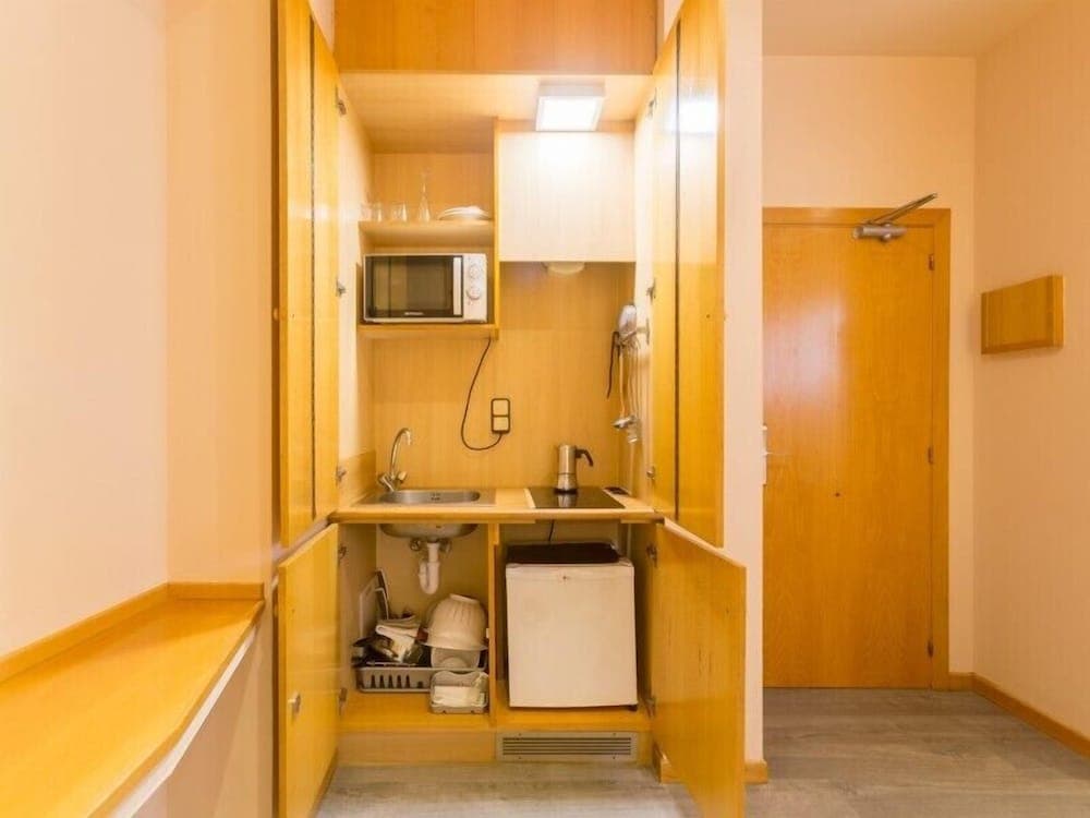 Kitchen at Hospedium Apartamentos DV